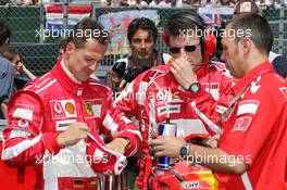 10.07.2005 Silverstone, England, Michael Schumacher, GER, Ferrari with Chris Dyer, GBR, Ferrari Race Engineer and his Physio  - July, Formula 1 World Championship, Rd 11, British Grand Prix, Silverstone, England