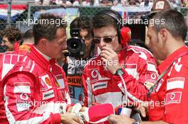 10.07.2005 Silverstone, England, Michael Schumacher, GER, Ferrari with Chris Dyer, GBR, Ferrari Race Engineer and his Physio  - July, Formula 1 World Championship, Rd 11, British Grand Prix, Silverstone, England