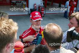 10.07.2005 Silverstone, England, Michael Schumacher (GER), Scuderia Ferrari Marlboro F2005, talking to the German press after the race after finishing a dissapointing 6th place - July, Formula 1 World Championship, Rd 11, British Grand Prix, Silverstone, England