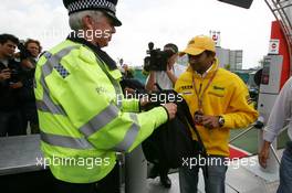 07.07.2005 Silverstone, England Narain Karthikeyan (IND), Jordan Toyota, Portrait, having his bags checked at the entry of the Formula One paddock - July, Formula 1 World Championship, Rd 11, British Grand Prix, Silverstone, England