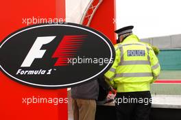 07.07.2005 Silverstone, England Police doing extra security checks on bags at the entry of the Formula One paddock - July, Formula 1 World Championship, Rd 11, British Grand Prix, Silverstone, England