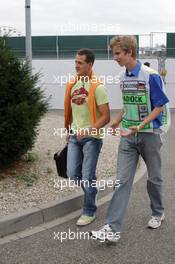 22.07.2005 Hockenheim, Germany, Michael Schumacher, GER, Ferrari, discussing with a security - July, Formula 1 World Championship, Rd 12, German Grand Prix, Hockenheim, Germany, Grosser Mobil 1 Preis von Deutschland, GER, Hockenheimring Baden-Württemberg