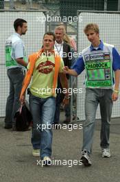 22.07.2005 Hockenheim, Germany, Michael Schumacher, GER, Ferrari, discussing with a security - July, Formula 1 World Championship, Rd 12, German Grand Prix, Hockenheim, Germany, Grosser Mobil 1 Preis von Deutschland, GER, Hockenheimring Baden-Württemberg