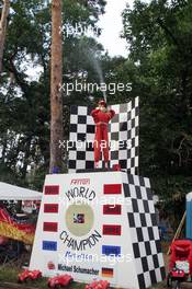 22.07.2005 Hockenheim, Germany, Fan feature, Michael Schumacher dummy on a podium sprays with "Champaign" - July, Formula 1 World Championship, Rd 12, German Grand Prix, Hockenheim, Germany, Grosser Mobil 1 Preis von Deutschland, GER, Hockenheimring Baden-Württemberg