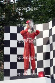 22.07.2005 Hockenheim, Germany, Fan feature, Michael Schumacher dummy on a podium sprays with "Champaign" - July, Formula 1 World Championship, Rd 12, German Grand Prix, Hockenheim, Germany, Grosser Mobil 1 Preis von Deutschland, GER, Hockenheimring Baden-Württemberg