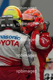 24.07.2005 Hockenheim, Germany, Michael Schumacher, GER, Ferrari and Ralf Schumacher, GER, Panasonic Toyota Racing after the race in the park ferme - July, Formula 1 World Championship, Rd 12, German Grand Prix, Hockenheim, Germany, Grosser Mobil 1 Preis von Deutschland, GER, Hockenheimring Baden-Württemberg