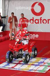 21.07.2005 Hockenheim, Germany, Vodafone Event at Hockenheim Talhaus, Michael Schumacher, GER, Ferrari and Rubens Barrichello, BRA, Ferrari driving on a Quad-Bike to make paintings on a big canvas for Charity - July, Formula 1 World Championship, Rd 12, German Grand Prix, Hockenheim, Germany, Grosser Mobil 1 Preis von Deutschland, GER, Hockenheimring Baden-Württemberg