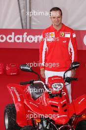 21.07.2005 Hockenheim, Germany, Vodafone Event at Hockenheim Talhaus, Michael Schumacher, GER, Ferrari and Rubens Barrichello, BRA, Ferrari driving on a Quad-Bike to make paintings on a big canvas for Charity - July, Formula 1 World Championship, Rd 12, German Grand Prix, Hockenheim, Germany, Grosser Mobil 1 Preis von Deutschland, GER, Hockenheimring Baden-Württemberg