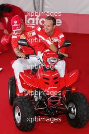 21.07.2005 Hockenheim, Germany, Vodafone Event at Hockenheim Talhaus, Michael Schumacher, GER, Ferrari and Rubens Barrichello, BRA, Ferrari driving on a Quad-Bike to make paintings on a big canvas for Charity - July, Formula 1 World Championship, Rd 12, German Grand Prix, Hockenheim, Germany, Grosser Mobil 1 Preis von Deutschland, GER, Hockenheimring Baden-Württemberg