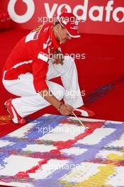 21.07.2005 Hockenheim, Germany, Vodafone Event at Hockenheim Talhaus, Michael Schumacher, GER, Ferrari and Rubens Barrichello, BRA, Ferrari driving on a Quad-Bike to make paintings on a big canvas for Charity - July, Formula 1 World Championship, Rd 12, German Grand Prix, Hockenheim, Germany, Grosser Mobil 1 Preis von Deutschland, GER, Hockenheimring Baden-Württemberg