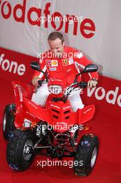 21.07.2005 Hockenheim, Germany, Vodafone Event at Hockenheim Talhaus, Michael Schumacher, GER, Ferrari and Rubens Barrichello, BRA, Ferrari driving on a Quad-Bike to make paintings on a big canvas for Charity - July, Formula 1 World Championship, Rd 12, German Grand Prix, Hockenheim, Germany, Grosser Mobil 1 Preis von Deutschland, GER, Hockenheimring Baden-Württemberg