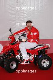 21.07.2005 Hockenheim, Germany, Vodafone Event at Hockenheim Talhaus, Michael Schumacher, GER, Ferrari and Rubens Barrichello, BRA, Ferrari driving on a Quad-Bike to make paintings on a big canvas for Charity - July, Formula 1 World Championship, Rd 12, German Grand Prix, Hockenheim, Germany, Grosser Mobil 1 Preis von Deutschland, GER, Hockenheimring Baden-Württemberg