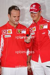 21.07.2005 Hockenheim, Germany, Vodafone Event at Hockenheim Talhaus, Michael Schumacher, GER, Ferrari and Rubens Barrichello, BRA, Ferrari driving on a Quad-Bike to make paintings on a big canvas for Charity - July, Formula 1 World Championship, Rd 12, German Grand Prix, Hockenheim, Germany, Grosser Mobil 1 Preis von Deutschland, GER, Hockenheimring Baden-Württemberg