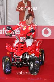 21.07.2005 Hockenheim, Germany, Vodafone Event at Hockenheim Talhaus, Michael Schumacher, GER, Ferrari and Rubens Barrichello, BRA, Ferrari driving on a Quad-Bike to make paintings on a big canvas for Charity - July, Formula 1 World Championship, Rd 12, German Grand Prix, Hockenheim, Germany, Grosser Mobil 1 Preis von Deutschland, GER, Hockenheimring Baden-Württemberg