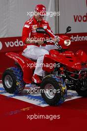 21.07.2005 Hockenheim, Germany, Vodafone Event at Hockenheim Talhaus, Michael Schumacher, GER, Ferrari and Rubens Barrichello, BRA, Ferrari driving on a Quad-Bike to make paintings on a big canvas for Charity - July, Formula 1 World Championship, Rd 12, German Grand Prix, Hockenheim, Germany, Grosser Mobil 1 Preis von Deutschland, GER, Hockenheimring Baden-Württemberg