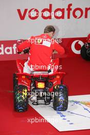 21.07.2005 Hockenheim, Germany, Vodafone Event at Hockenheim Talhaus, Michael Schumacher, GER, Ferrari and Rubens Barrichello, BRA, Ferrari driving on a Quad-Bike to make paintings on a big canvas for Charity - July, Formula 1 World Championship, Rd 12, German Grand Prix, Hockenheim, Germany, Grosser Mobil 1 Preis von Deutschland, GER, Hockenheimring Baden-Württemberg