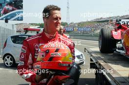 29.07.2005 Hungaroring, Hungary, Michael Schumacher, GER, Ferrari, returns to pitlane after he had to stop the Ferrari on track - July, Formula 1 World Championship, Rd 13, Hungarian Grand Prix, Budapest, Hungary, HUN, Practice