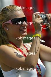 29.07.2005 Hungaroring, Hungary, Nice girl in the paddock taking a picture - July, Formula 1 World Championship, Rd 13, Hungarian Grand Prix, Budapest, Hungary, HUN