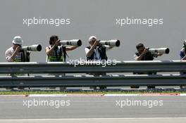 29.07.2005 Hungaroring, Hungary, Photographers behind the guard rail - July, Formula 1 World Championship, Rd 13, Hungarian Grand Prix, Budapest, Hungary, HUN, Practice