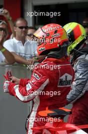 31.07.2005 Hungaroring, Hungary, Michael Schumacher, GER, Ferrari, and Ralf Schumacher, GER, Panasonic Toyota Racing - July, Formula 1 World Championship, Rd 13, Hungarian Grand Prix, Budapest, Hungary, HUN, Podium