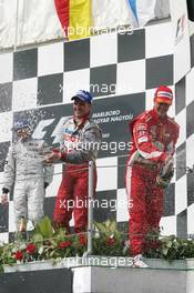 31.07.2005 Hungaroring, Hungary, Kimi Raikkonen, FIN, Räikkönen, McLaren Mercedes, Michael Schumacher, GER, Ferrari and Ralf Schumacher, GER, Panasonic Toyota Racing - July, Formula 1 World Championship, Rd 13, Hungarian Grand Prix, Budapest, Hungary, HUN, Podium