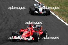31.07.2005 Hungaroring, Hungary, Michael Schumacher (GER), Scuderia Ferrari Marlboro F2005, leads Kimi Raikkonen (FIN), West McLaren Mercedes MP4-20 - July, Formula 1 World Championship, Rd 13, Hungarian Grand Prix, Budapest, Hungary, HUN, Race