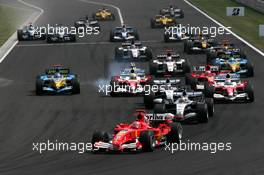 31.07.2005 Hungaroring, Hungary, The start of the race with Michael Schumacher (GER), Scuderia Ferrari Marlboro F2005, leading the field into the first corner - July, Formula 1 World Championship, Rd 13, Hungarian Grand Prix, Budapest, Hungary, HUN, Race