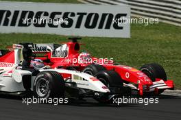 31.07.2005 Hungaroring, Hungary, Rubens Barrichello (BRA), Scuderia Ferrari Marlboro F2005 and Takuma Sato (JPN), Lucky Strike BAR Honda 007, side-by-side in the 2nd corner - July, Formula 1 World Championship, Rd 13, Hungarian Grand Prix, Budapest, Hungary, HUN, Race
