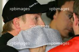 30.07.2005 Hungaroring, Hungary, Kimi Raikkonen (FIN), West McLaren Mercedes, Portrait, swipping the sweat of his face - July, Formula 1 World Championship, Rd 13, Hungarian Grand Prix, Budapest, Hungary, HUN, Practice