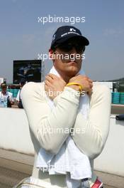 31.07.2005 Hungaroring, Hungary, Mark Webber (AUS), BMW Williams F1 Team, Portrait, wrapped in a cold water drained towel to keep cool - July, Formula 1 World Championship, Rd 13, Hungarian Grand Prix, Budapest, Hungary, HUN, Grid