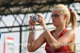 28.07.2005 Hungaroring, Hungary, Girl with camera - July, Formula 1 World Championship, Rd 13, Hungarian Grand Prix, Budapest, Hungary, HUN