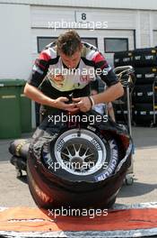 28.07.2005 Hungaroring, Hungary, BAR mechanic preparing the tyres - July, Formula 1 World Championship, Rd 13, Hungarian Grand Prix, Budapest, Hungary, HUN