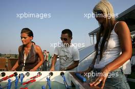 28.07.2005 Hungaroring, Hungary, Christian Klien (AUT), Red Bull Racing, playing table soccer with girls at the Red Bull hospitality - July, Formula 1 World Championship, Rd 13, Hungarian Grand Prix, Budapest, Hungary, HUN