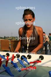 28.07.2005 Hungaroring, Hungary, Girl at the Red Bull hospitality playing table soccer - July, Formula 1 World Championship, Rd 13, Hungarian Grand Prix, Budapest, Hungary, HUN