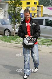 01.09.2005 Monza, Italy, Michael Schumacher, GER, Ferrari arrives at the track on a Ducati motorbike - September, Formula 1 World Championship, Rd 15, Italian Grand Prix