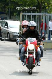 01.09.2005 Monza, Italy, Michael Schumacher, GER, Ferrari and Sabine Kehm, Michael Schumacher's personal press officer arrive at the circuit - September, Formula 1 World Championship, Rd 15, Italian Grand Prix