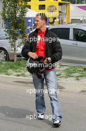 01.09.2005 Monza, Italy, Michael Schumacher, GER, Ferrari arrives at the track on a Ducati motorbike - September, Formula 1 World Championship, Rd 15, Italian Grand Prix