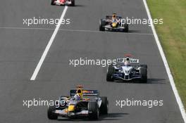09.10.2005 Suzuka, Japan,  David Coulthard, GBR, Red Bull Racing, RB1, Action, Track leads Mark Webber, AUS, BMW WilliamsF1 Team, FW27, Action, Track - October, Formula 1 World Championship, Rd 18, Japanese Grand Prix, Sunday Race