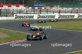 09.10.2005 Suzuka, Japan,  David Coulthard, GBR, Red Bull Racing, RB1, Action, Track leads Mark Webber, AUS, BMW WilliamsF1 Team, FW27, Action, Track - October, Formula 1 World Championship, Rd 18, Japanese Grand Prix, Sunday Race
