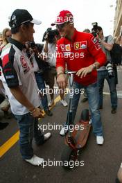 21.05.2005 Monte-Carlo, Monaco,  Takuma Sato, JPN,  BAR Honda talking with Michael Schumacher, GER, Ferrari in the paddock area - May, Formula 1 World Championship, Rd 6, Monaco Grand Prix, MON