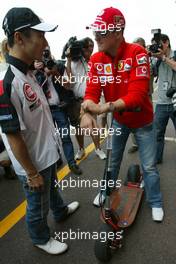 21.05.2005 Monte-Carlo, Monaco,  Takuma Sato, JPN,  BAR Honda talking with Michael Schumacher, GER, Ferrari in the paddock area - May, Formula 1 World Championship, Rd 6, Monaco Grand Prix, MON