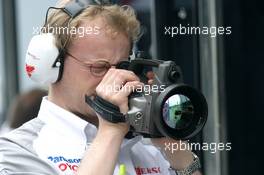 25.08.2005 Monza, Italy, A Toyota engineer filming the cars with what seems to be a infra red camera to look at heat - August, F1 testing, Autodromo Nazionale Monza, Italy