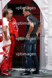 25.08.2005 Monza, Italy, Michael Schumacher, GER, Ferrari, talking to Luca Badoer, ITA, Test Driver, Scuderia Ferrari - August, F1 testing, Autodromo Nazionale Monza, Italy