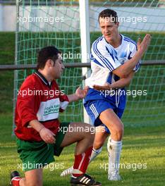 30.11.2005, Gland, Swizerland,  Soccer 3.Liga - FC Lusitano Gland - FC Echichens -  Echiechens Calado  and Michael Schumacher, GER, Scuderia Ferrari after a FOUL