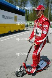 22.04.2005 Imola, San Marino, Michael Schumacher, GER, Ferrari on a scooter - April, Formula 1 World Championship, Rd 4, San Marino Grand Prix, RSM