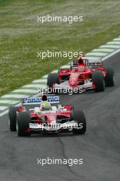 24.04.2005 Imola, San Marino, Ralf Schumacher, GER, Panasonic Toyota Racing, TF105, Action, Track leads Michael Schumacher, GER, Scuderia Ferrari Marlboro, F2005, Action, Track - April, Formula 1 World Championship, Rd 4, San Marino Grand Prix, RSM, Race