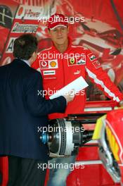 21.04.2005 Imola, San Marino, Jean Todt, FRA, Ferrari, Teamchief, General Manager, GES and Michael Schumacher, GER, Ferrari in the garage - Thursday, April, Formula 1 World Championship, Rd 4, San Marino Grand Prix, RSM