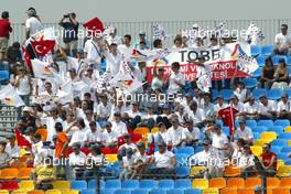 19.08.2005 Istanbul, Turkey, Turkish fans celebrate the countries first F1 action - August, Formula 1 World Championship, Rd 14, Turkish Grand Prix, Istanbul Park, Turkey