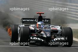20.08.2005 Istanbul, Turkey, Robert Doornbos, NED, Minardi Cosworth, Action, Track drives back into the pits with his brakes on fire - August, Formula 1 World Championship, Rd 14, Turkish Grand Prix, Istanbul Park, Turkey, Qualifying