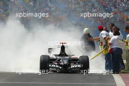 20.08.2005 Istanbul, Turkey, The flames from Robert Doornbos's Minardi were put out - August, Formula 1 World Championship, Rd 14, Turkish Grand Prix, Istanbul Park, Turkey, Qualifying